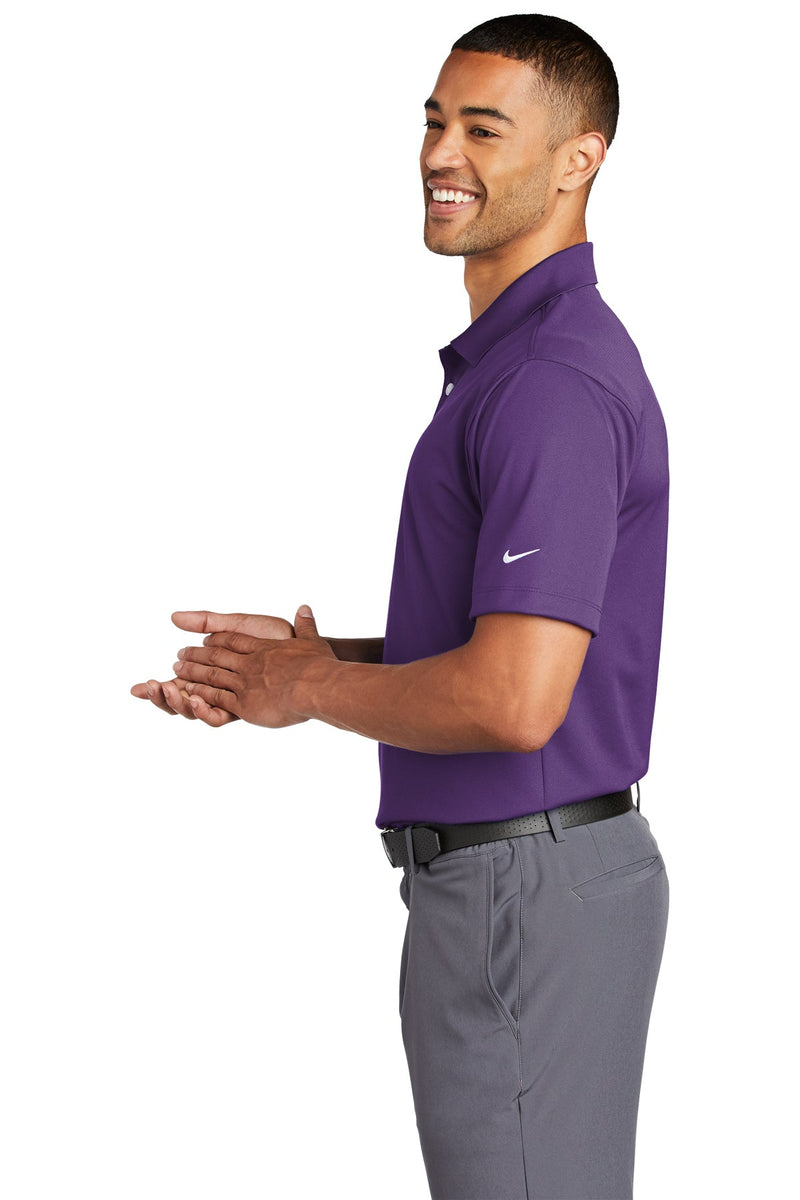 Male model wearing purple K-state polo - side view