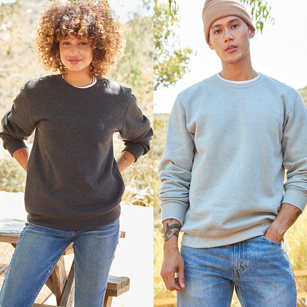 one female and one male model in the crewneck sweatshirts
