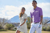 Lifestyle photo of one female and one male golfing..  Both wearing  nike polos