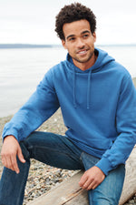 Male model wearing blue hooded pullover 