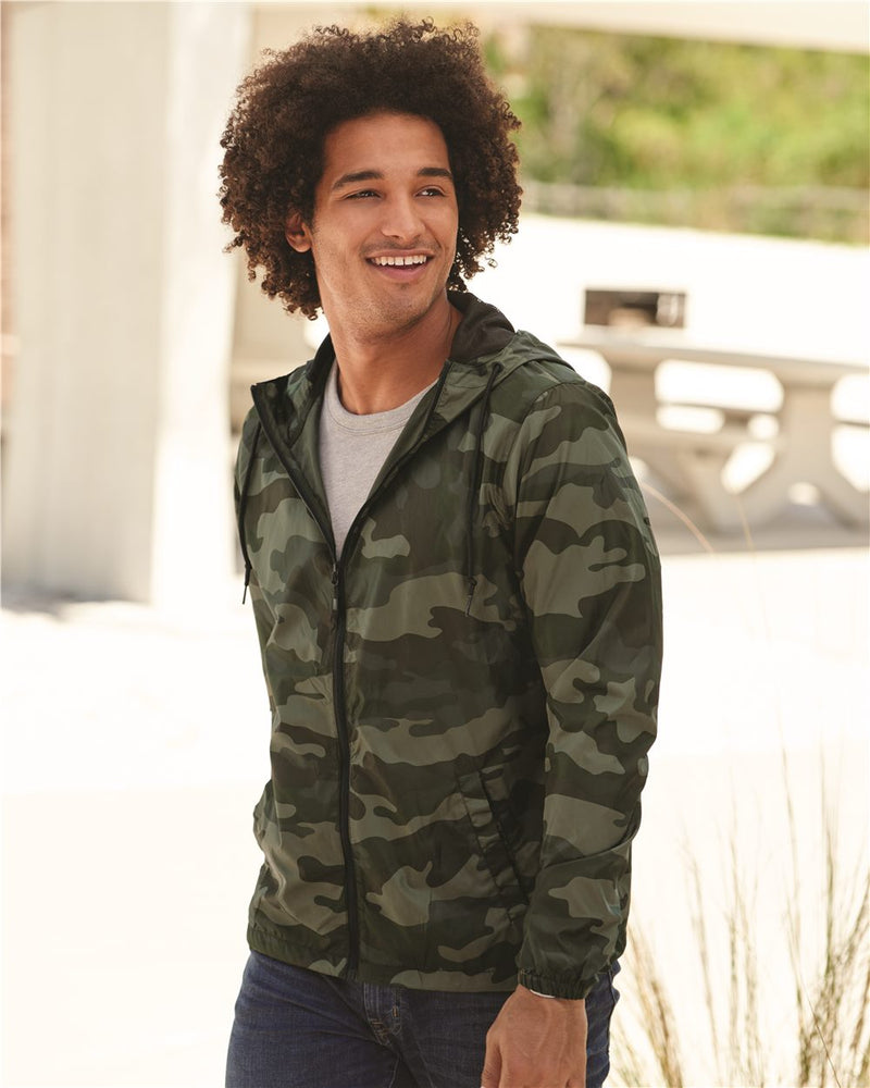 Male model in the green camo windbreaker jacket lifestyle shot